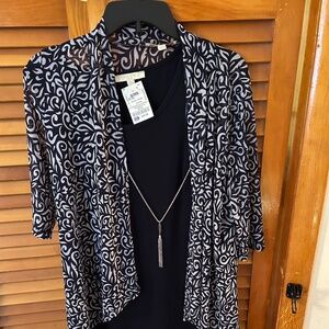 Black and white 2 piece dress with long jacket and 3/4 sleeves for jacket.